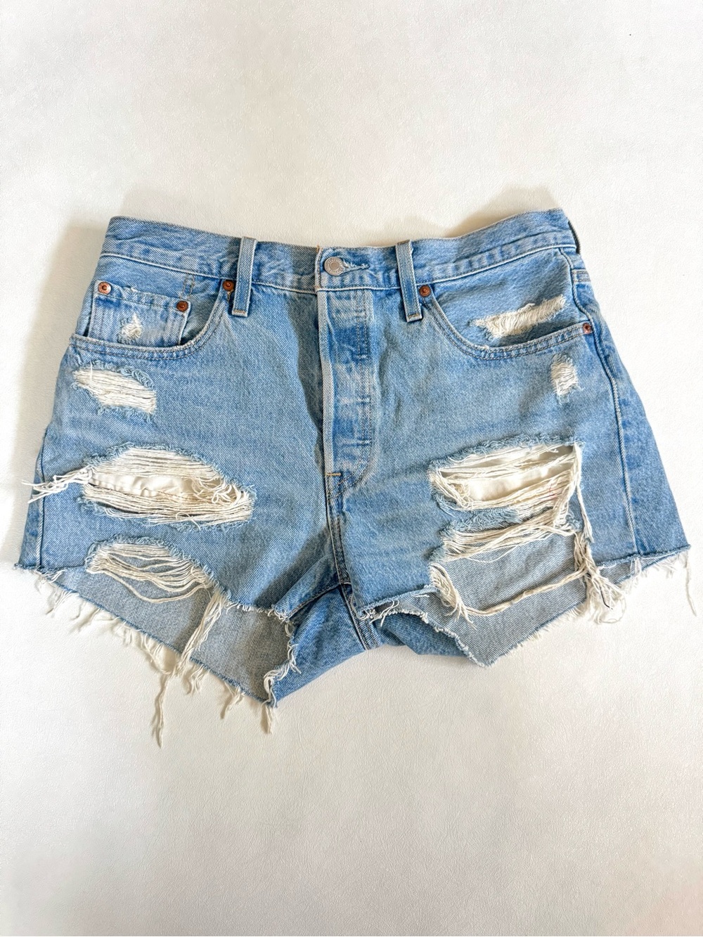 Levi's blue 501 straight denim shorts with distressed details size W29